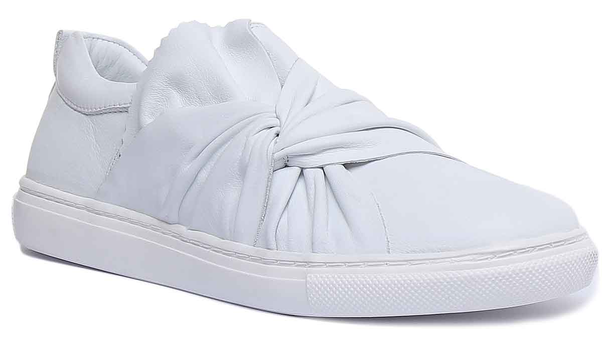 White sneakers with store bow